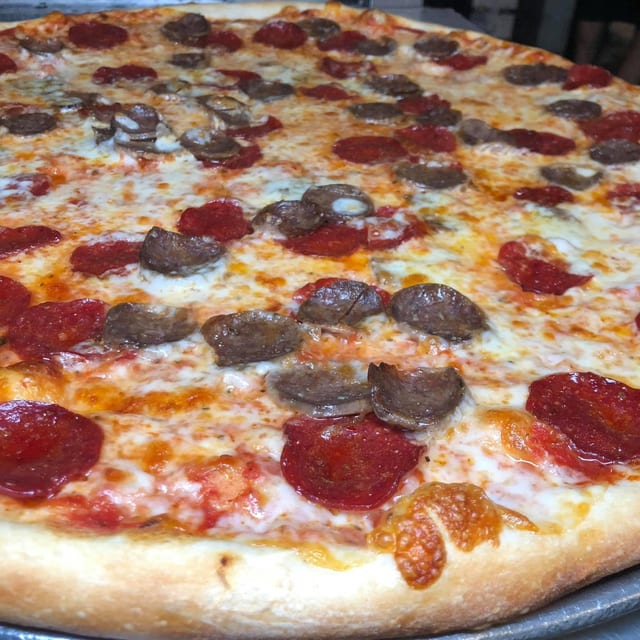 PEPPERONI & SAUSAGE JUMBO SLICE.